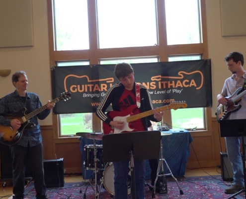 teenage student playing at guitar lessons ithaca student concert 2024