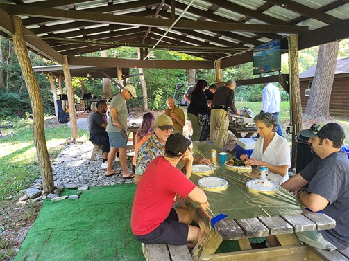 people feasting at Guitar Lessons Ithaca student party 2024