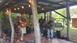 Dennis and Maureen jamming at Guitar Lessons Ithaca student party 2024